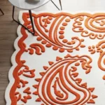 Ivory and Orange Scalloped Edge Floral Wool Area Rug