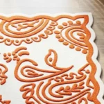 Ivory and Orange Scalloped Edge Floral Wool Area Rug