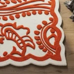 Ivory and Orange Scalloped Edge Floral Wool Area Rug